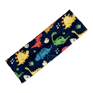 Primo piano del tessuto della fascia per bambini dinosauro, stampa cartoon carina su blu.