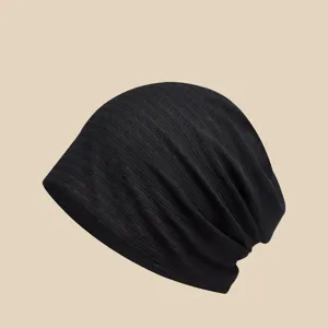 Black lightweight slouchy beanie hat for women, breathable chemo cap and head wrap.