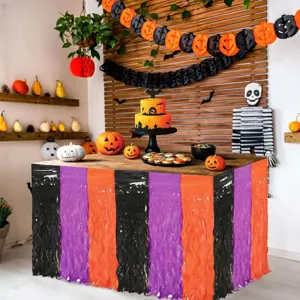 Halloween fringe table skirt detail showing black, purple and orange color combination for party.