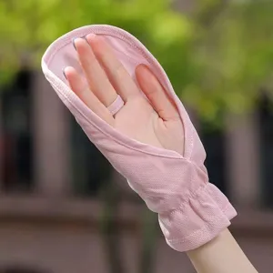 Close-up detail view of lightweight pink fingerless sun protection gloves for outdoor driving.