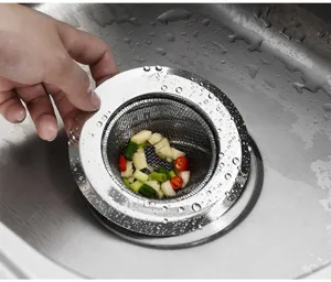Stainless steel kitchen sink strainer basket for food waste filtering, durable drain catcher detail.