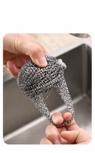 Stainless steel scrubber with hanging loop, durable mesh dishwashing cleaning sponge brush for kitchen.