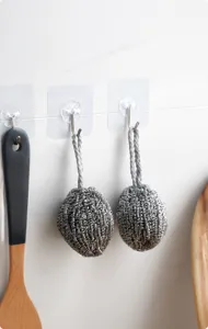 Stainless steel cleaning ball with lanyard, hanging design for easy kitchen dishwashing.