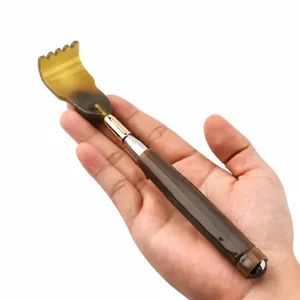 Telescopic back scratcher with horn-like head and massage ball for daily relaxation and relief.
