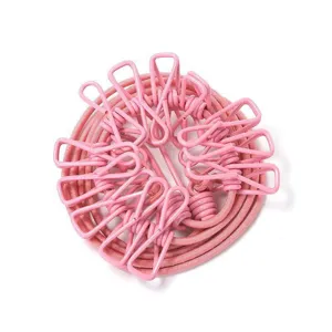 Portable travel clothesline with clips, windproof elastic laundry rope for home and hotel.