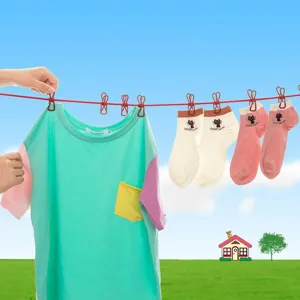 Portable retractable travel clothesline with windproof clips for home, hotel and outdoor drying.