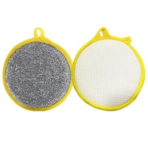 Double-sided dishwashing sponge with yellow border, circular kitchen cleaner tool for pots.