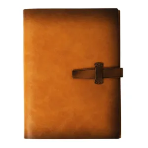 Vintage brown leather notebook with strap closure, loose-leaf diary journal for school daily use.