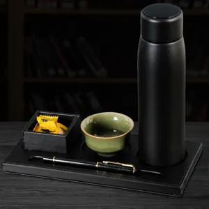 Multifunctional leather desk pad cup holder set for business office and hotel meetings.