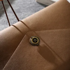 Brown leather travel journal notebook with elastic band and vintage metal snap button.