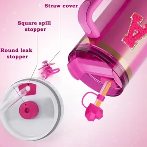 Stanley tumbler accessory set detail with straw cover, square spill stopper and round leak stopper.