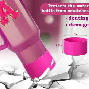 Pink silicone tumbler boot and water bottle protective sleeve with glitter letter design.