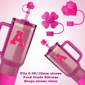 Pink insulated tumbler cup with cute silicone straw covers and letter A patch set.