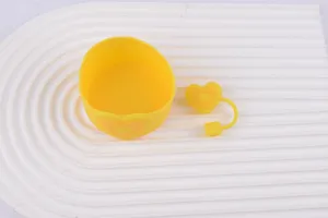 Yellow silicone cup boot and cute heart straw topper detail, anti-slip and dustproof design.