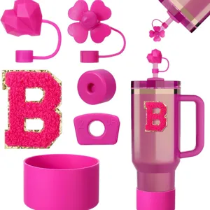 Pink Stanley cup silicone accessories set including straw covers letter B patch and boot.