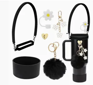 Tumbler accessories set with black strap, silicone boot, flower straw cover and pom pom charm.