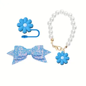 Close up of blue flower straw cover, glitter bow and pearl chain cup accessories detail.