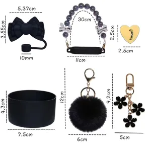 Black cup accessories set featuring silicone boot, bow straw topper, charms, and pompom.