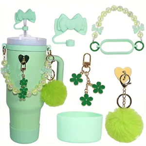 Mint green tumbler cup set with straw topper bead chain flower pendant and silicone boot.