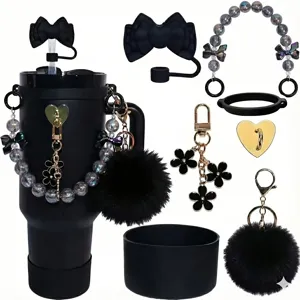 Black tumbler accessories set featuring bow straw cover bead chain furry pom pom and silicone boot