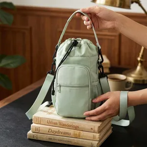 Multifunctional waterproof water bottle bag with strap and front pocket for outdoor travel.
