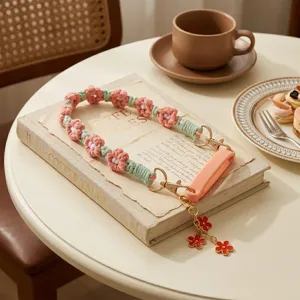Handmade woven flower water bottle strap detailed view, cute cup handle accessory.