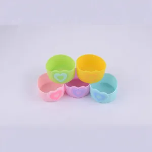 Colorful silicone cup sleeves with cute heart designs, anti-slip protective accessories for use.