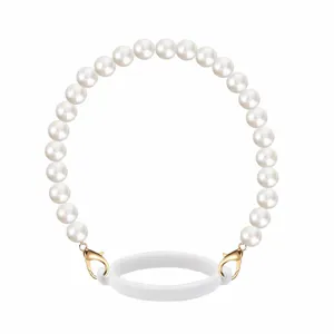 Pearl cup strap detail showing smooth white beads, golden lobster clasp, and flexible silicone ring.