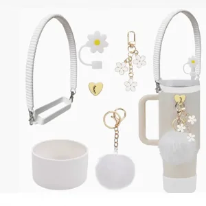 Stanley cup accessories set featuring silicone boot, daisy straw cover, and cute charm strap.