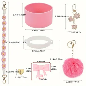 Stanley cup accessory set with pink silicone boot, braided flower chain and plush pom keychain.