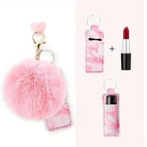 Pink pompom keychain with marble leather lipstick holder, cute bag charm accessory.