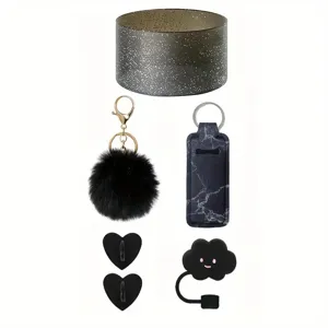 Stanley cup accessories set featuring silicone sleeve, pom pom keychain and holder.