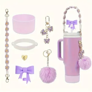 Purple insulated tumbler cup with braided flower chain, plush pom-pom and bow accessories detail