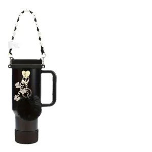 Black travel tumbler featuring a beaded chain strap, fluffy pom pom, and butterfly charms.