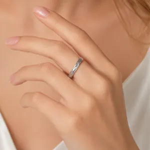 Stainless steel ring with niche leaf carved pattern, elegant minimalist band for daily wear.