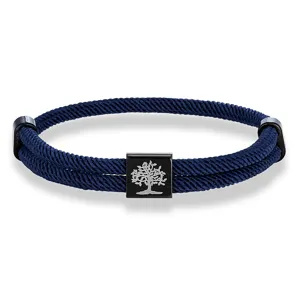 Close-up shot of the dark blue woven Milan rope bracelet with metal charm and black clasp.
