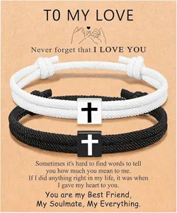 Detailed close-up view of couple cross braided rope bracelets with special greeting card gift.