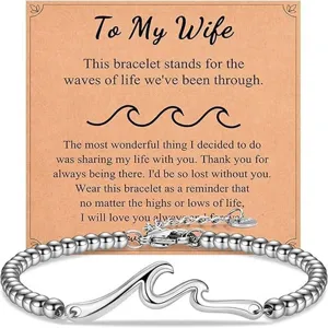 Detailed view of the silver bead wave bracelet with message card, featuring delicate metal beads.