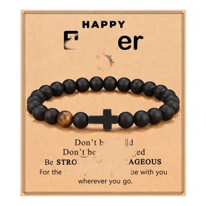 Black obsidian and tiger eye bead bracelet with cross pendant, fashion gift jewelry detail view.