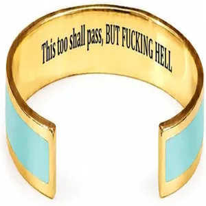 Detail view of the stainless steel open cuff bracelet with inner laser engraved inspirational text.