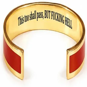 Gold stainless steel open cuff bracelet with red enamel and engraved inspirational quote text
