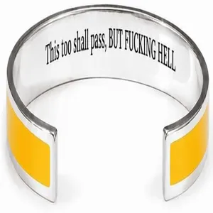 Stainless steel cuff bracelet detail showing yellow enamel inlay and engraved inner text clearly.