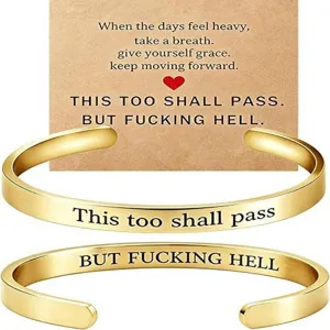 Stainless steel open cuff bracelets with inspirational engraved text and display card details.