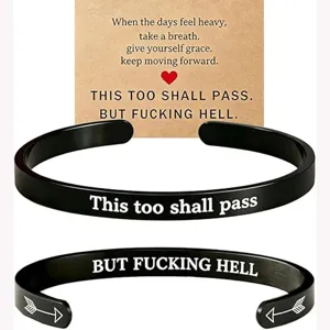 Stainless steel cuff bracelet with inspirational engraved text for daily motivation wear.