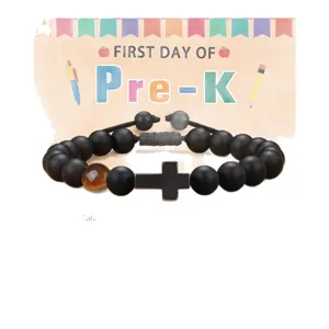 Black obsidian and tiger eye beaded bracelet featuring a stylish cross charm for daily wear.