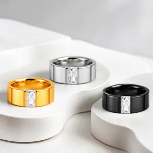 Closeup view of minimalist stainless steel rings featuring rectangular diamond crystals.