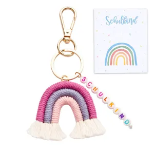 Handmade woven rainbow keychain with colorful beaded strap and matching card for students.