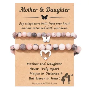 Mother and daughter beaded bracelet set with cute butterfly charms and heartfelt message card.