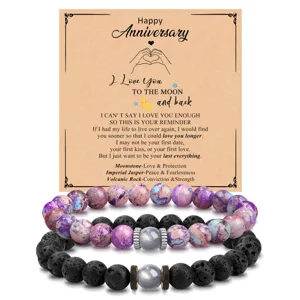 Detailed view of couple beaded bracelets featuring imperial jasper, volcanic rock, and moonstone.
