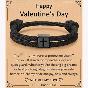 Men black braided rope bracelet with stainless steel cross charm on Valentine gift card.